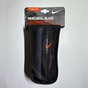 Nike Black Shin Guards with Orange Accent